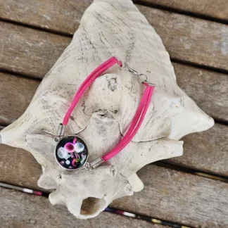 Lederarmband mit Cabochonperle Armkette Armband mit pinken Lederbändern 20mm Cabochon Glasperle mit pinken und silbernen Pusteblumen auf dunkelblauen Hintergrund